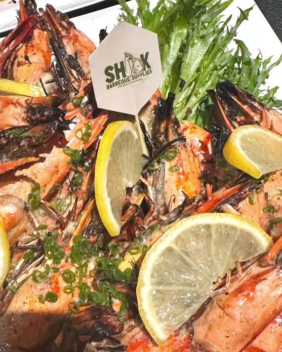 Grilled tiger prawns with lemon at a Shiok BBQ event in Singapore