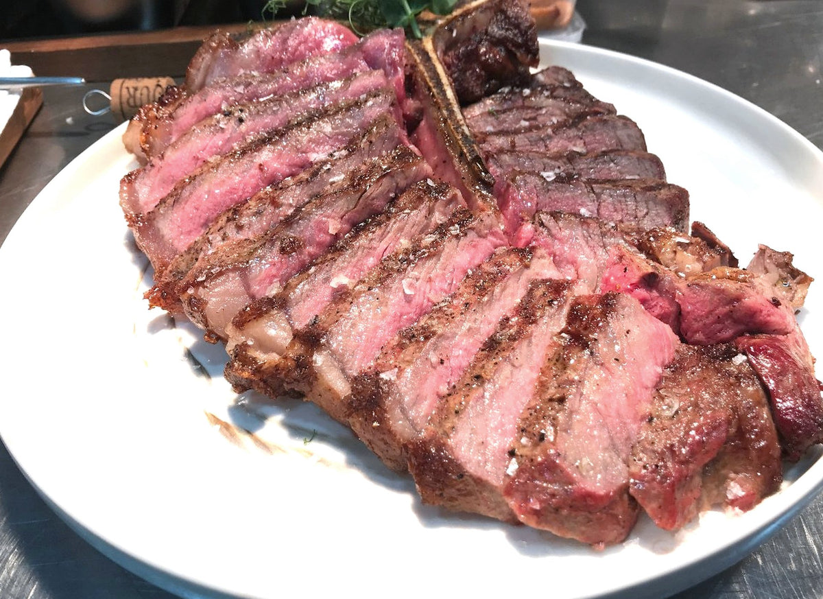 Sliced grilled T-bone steak plated, SHIOK Favourites Grill Mix package, Shiok BBQ Singapore
