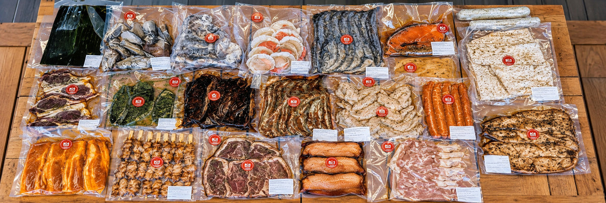 Vacuum-sealed marinated meat and seafood packs from a Shiok BBQ package, Singapore