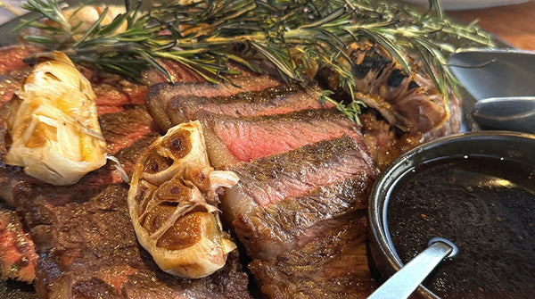 Bone-in steak grilling with garlic and rosemary, International BBQ 15-20pax, Shiok BBQ Singapore