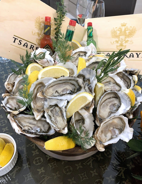 Fresh oysters on ice with lemon, Live Oyster Party Pack 60pcs, Shiok BBQ Singapore