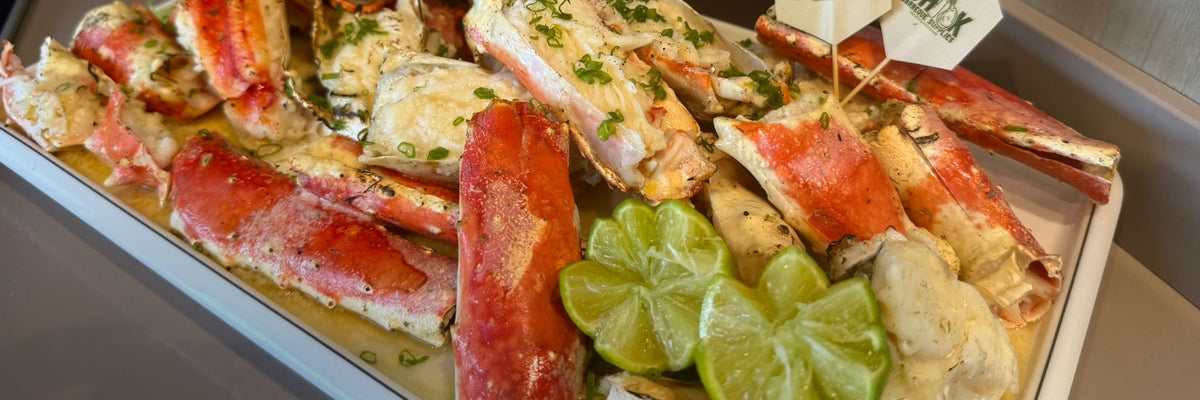 King crab legs with lime in a Shiok BBQ marinated seafood tray in Singapore
