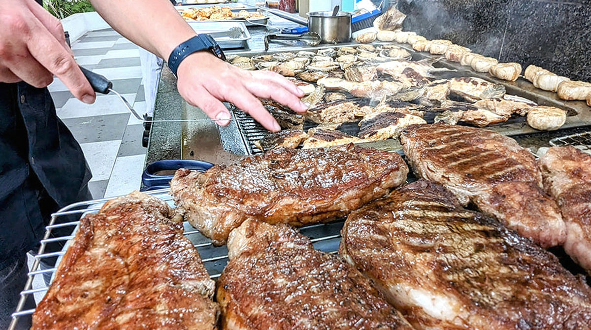 Chef grilling steaks on a long barbecue, Nice To MEAT You 15-20pax, Shiok BBQ Singapore