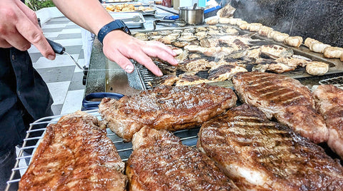 Chef grilling steaks on a long barbecue, Nice To MEAT You 15-20pax, Shiok BBQ Singapore