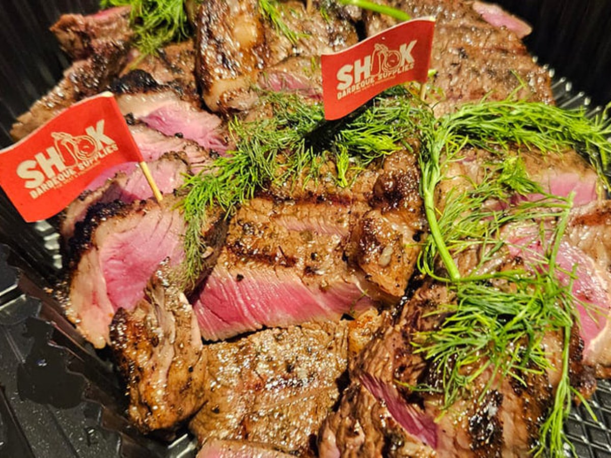 Marinated BBQ beef served on a tray at a Shiok BBQ assistant catering, Singapore