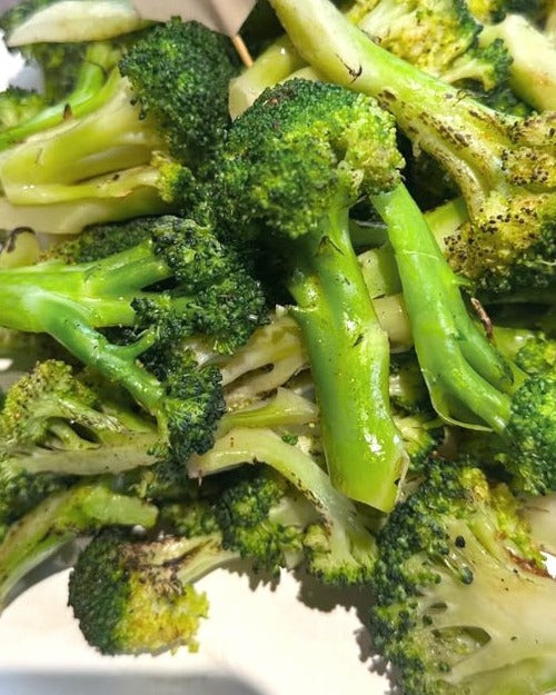 Charred garlic broccoli off the grill at a Shiok BBQ event, Singapore