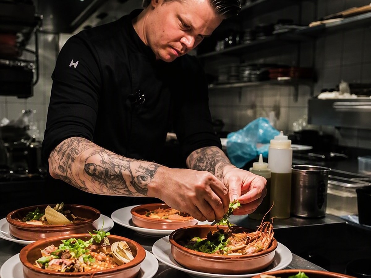 Shiok BBQ chef plating seafood in the production kitchen, Singapore